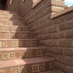 Terra cotta tiles go so well with the adobe bricks and limestone caps.